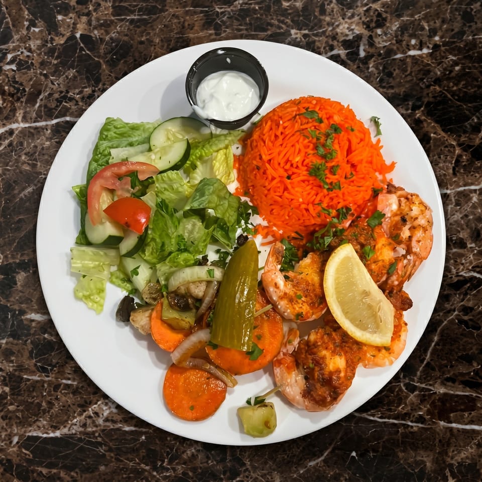 Grilled shrimp with orange rice, a side salad, and pickled vegetables on a white plate.